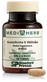 A bottle of Ganoderma & Shiitake herbal supplement next to a tablet.
